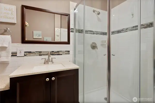 Another view of the vanity and Tiled shower in Unit B.