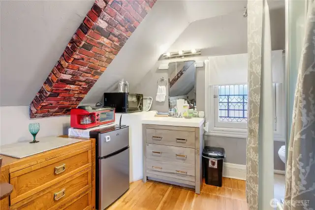 This is the kitchenette in the "Attic". The bathroom vanity, the shower is on the right.