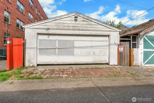 A view of the 2 car garage & large shop that is on the right.
