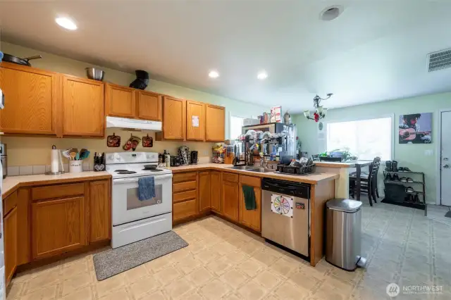 Kitchen offers addition space for dining.