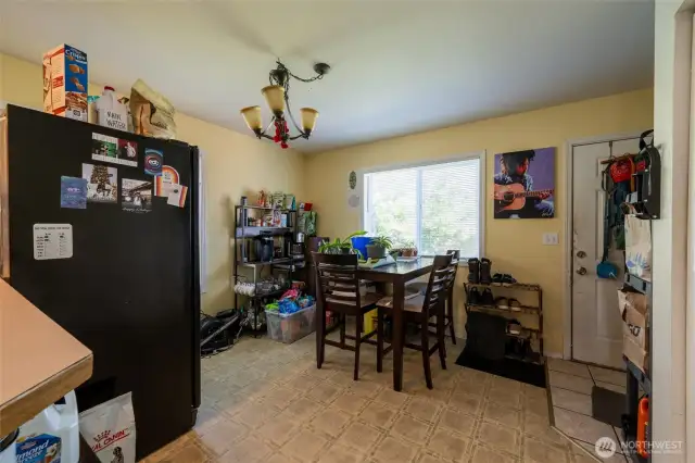 Dining area leads to back deck.