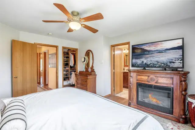 Primary bedroom with walk in closet with custom built closet system