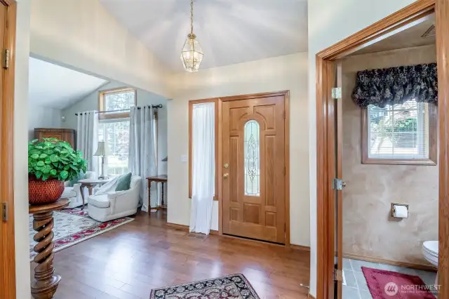 Front Entry with coved ceiling and half bath.