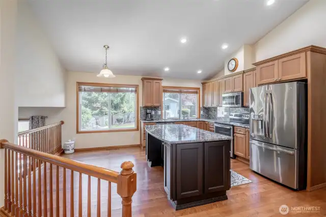 Spacious kitchen with large island and eating bar and space for a table.