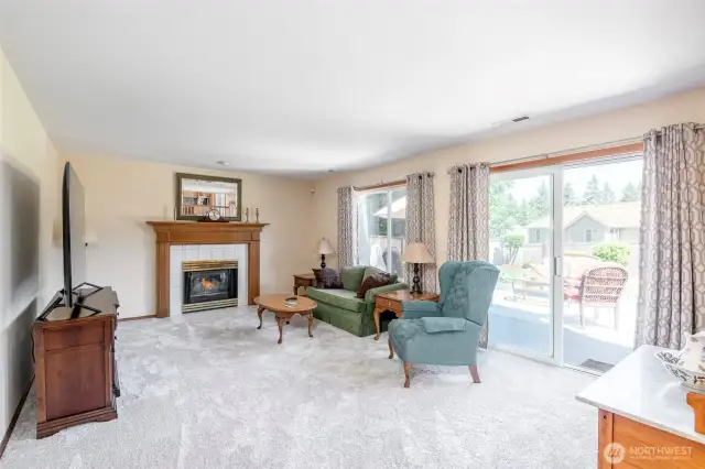 Light and bright family room with sliding glass door to rear deck and yard.