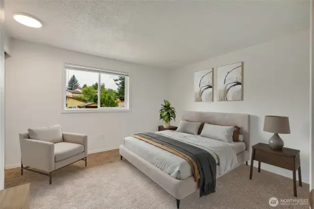 Two spacious bedrooms upstairs with new carpet. Photo virtually staged