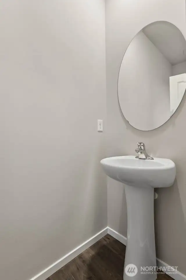 Main floor powder room. Photo's are for representational purposes only. Colors and finishes may differ.