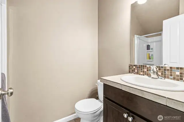 .75 bath on the main floor, shower behind the door.