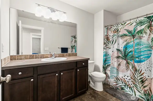 Full bath in the middle of the hall for the bedrooms and bonus room.
