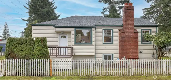 Perfectly situated on a corner lot with a brand-new 30-year roof.