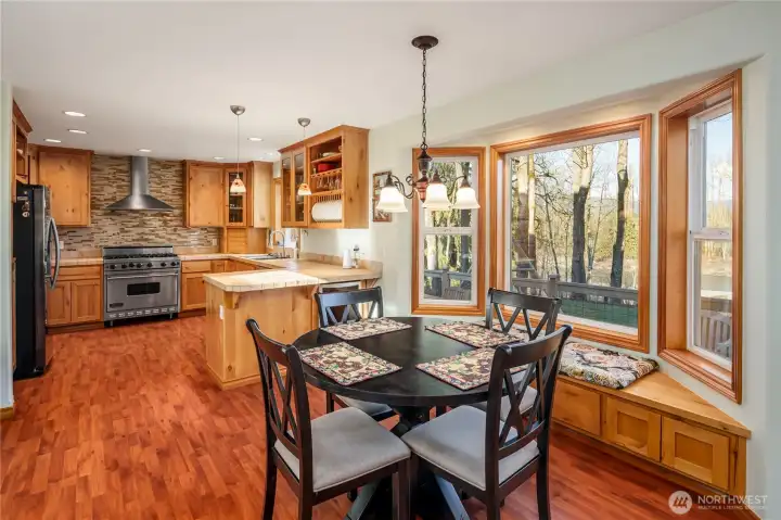Wine refrigerator located in counter facing breakfast area.