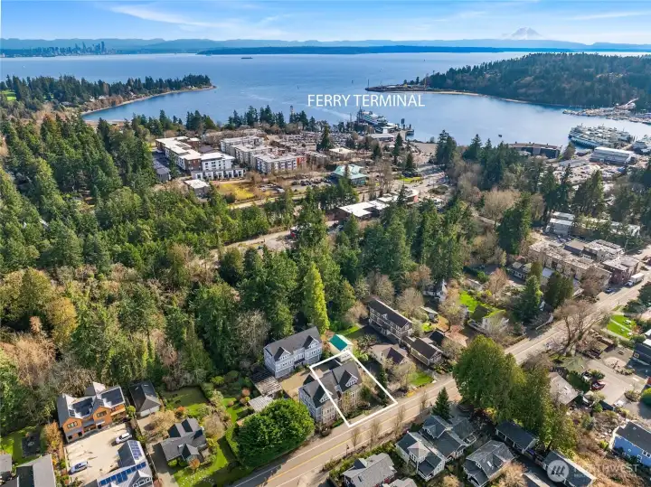 View from above shows proximity to the ferry terminal with Puget Sound, Seattle and Mt. Rainier in the distance (property boundaries are approximate).