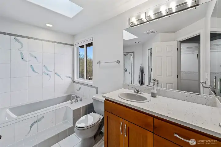 Primary bathroom with shower and large walk-in closet too