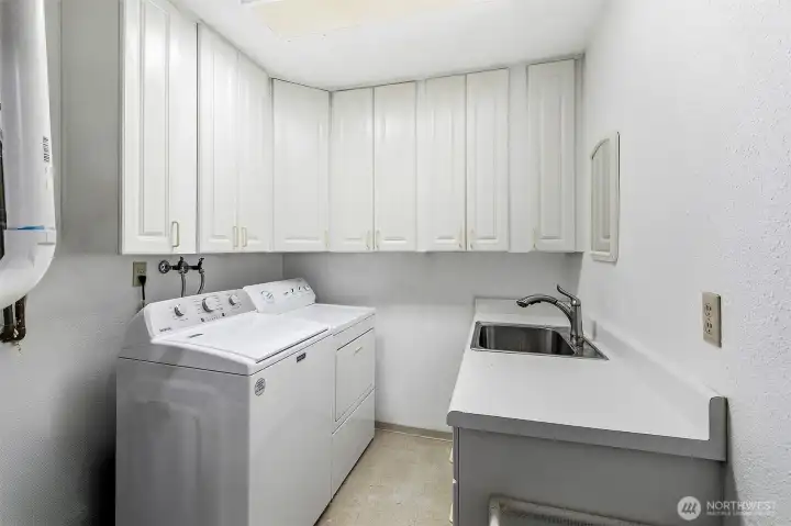 Laundry room with utility sink on the lower level