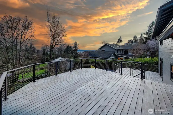 Large entertaining decks off the TV room and Kitchen and lower rec room