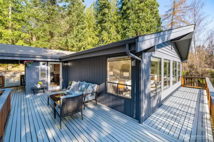 Expansive interior and exterior views of the North Cascades, Skagit Valley, Shelter Bay Marina, and the Swinomish Channel are enjoyed from the main-level decks. Sun screening shades included.