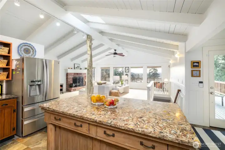 Serve your favorite feasts from this gorgeous custom island crafted from a repurposed antique buffet, topped with striking, one-of-a-kind granite.