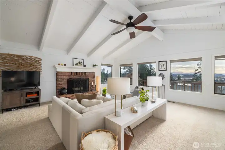 Soaring painted wood plank ceilings create a classic Northwest Contemporary aesthetic crowning the open, flexible great room design.