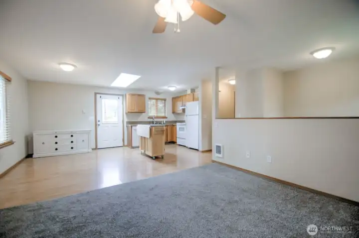 Living room looking towards kitchen and eating area.