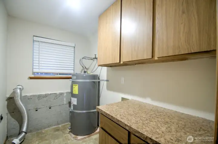 Utility room with washer and dryer hookup