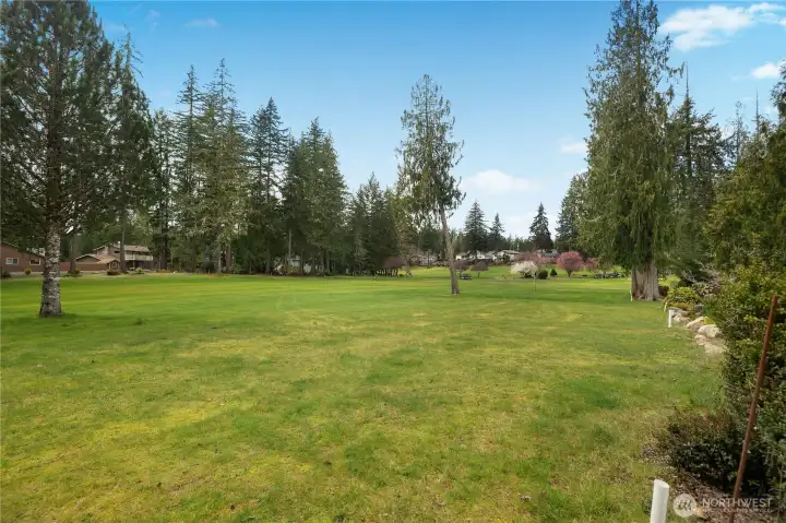 Golf course is your backyard, but don't worry about any balls hitting your home!