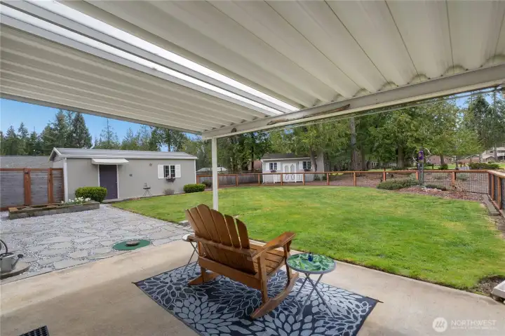 Covered patio, enjoy the view and the fully fenched dog friendly back yard.