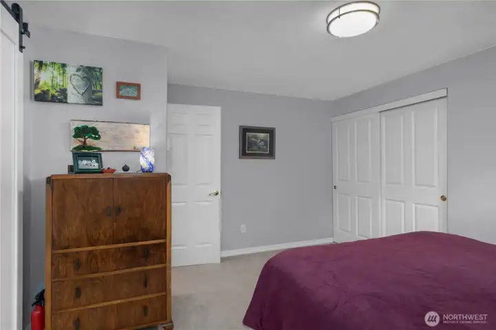 Primary bedroom with closet to the right.