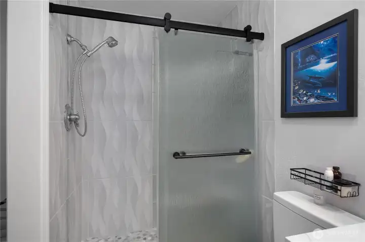 Newly tiled walk-in shower.  Updated bathroom.