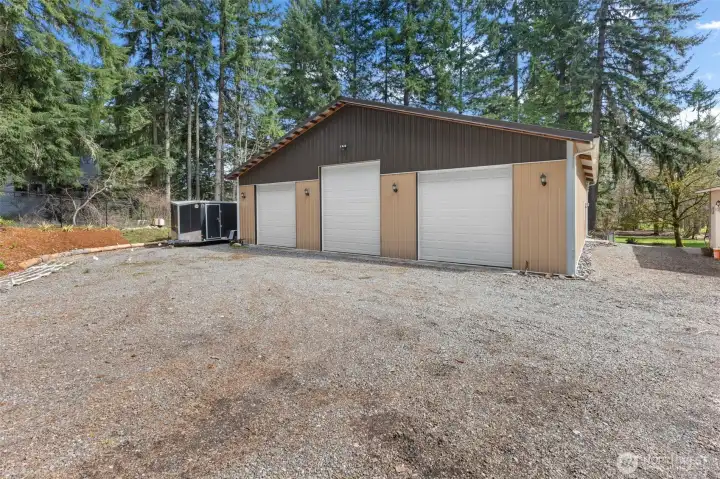 detached garage/shop with heat, insulation, openers