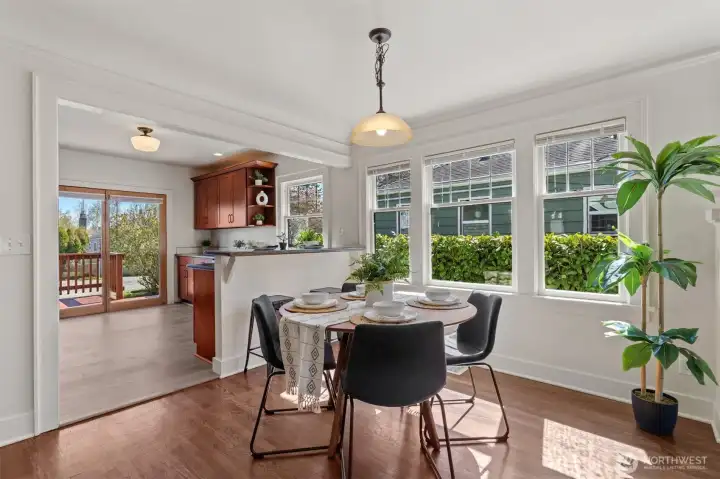 Kitchen with breakfast bar is great for entertaining or homework too! French doors to back deck fill the kitchen with natural light.
