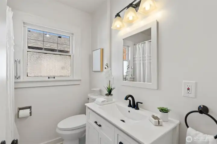 Full bath with new toilet and vanity!
