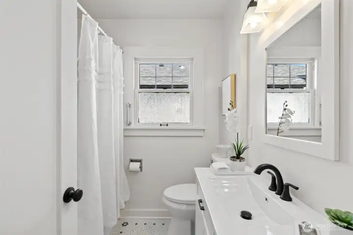 Enjoy a shower or a bath! And you'll love the charm in the tile floor.