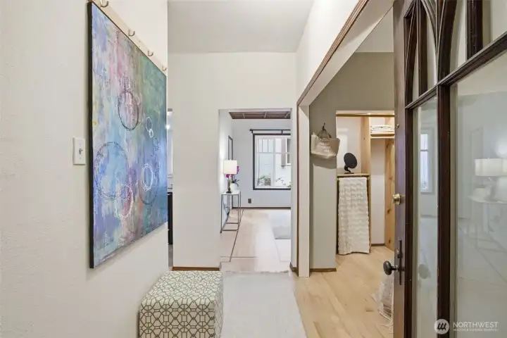 Bright entryway to the co-op with easy coat hooks.