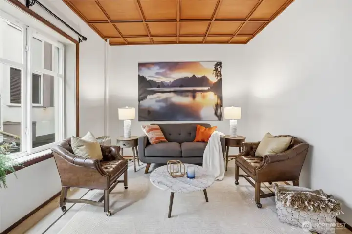 South facing windows with coffered ceilings keeping with the historical charm of this 1910 building.