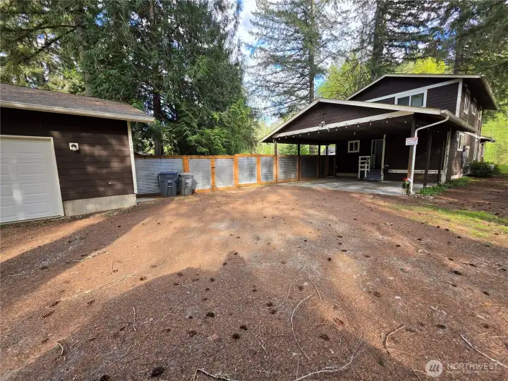 There are 5 covered parking spots plus 3 more without even parking on the grass. Plenty of room for RV, boat or any other vehical you'd like to park.