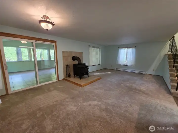 The living and dining room has a wood burning stove that heats the entire house.