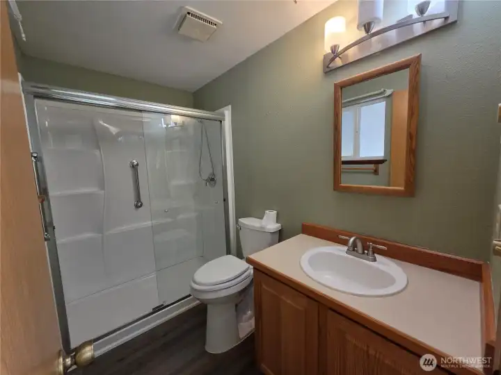 Also downstairs is a bathroom with a great walk-in shower.