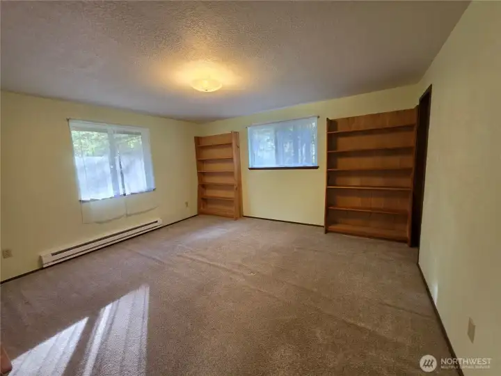 Looking back in the large 2nd bedroom upstairs with 2 large windows.