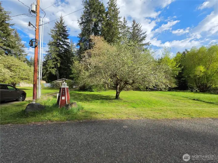 This is the 2nd lot. You'll see a stack to the right (where the grass is mowed to) and the power pole is the other side of lot 12. You can enjoy the privacy it gives you are build another home next door.