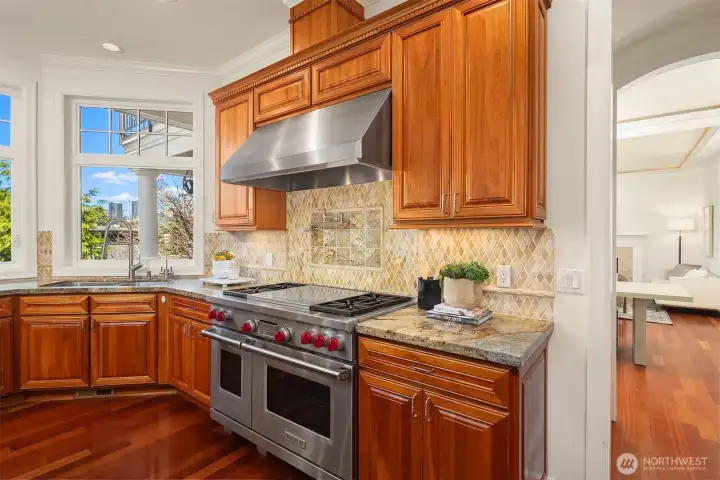 A Wolf oven with a pot filler faucet makes cooking easy.