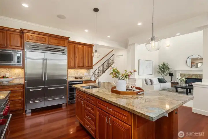 A large Sub-Zero fridge and wine/beverage cooler provide plenty of storage space in the kitchen.