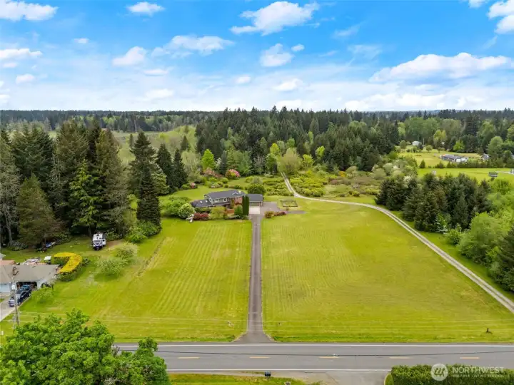 Beautiful flat acreage, fruit trees, blueberries and plenty of room to garden.