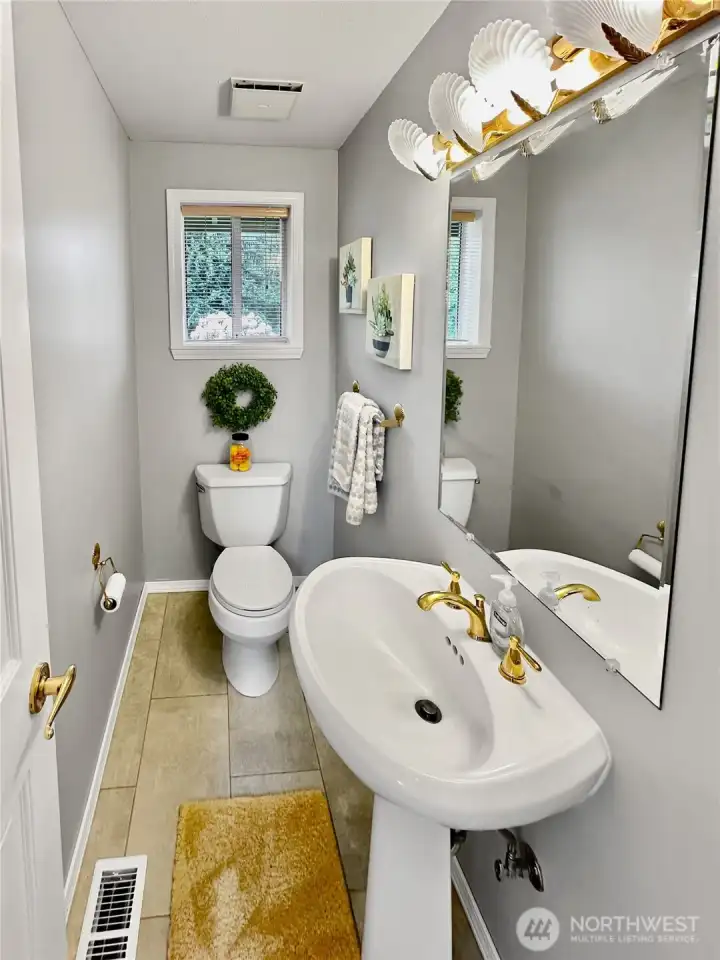 1/2 bath conveniently located between kitchen and family/rec room.