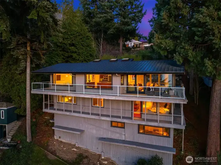Drone shot of the home overlooks the sound. most rooms offer stunning views!