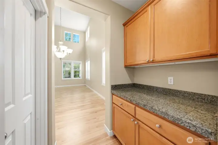 Walk-in pantry and butler's pantry between the kitchen and dining room.
