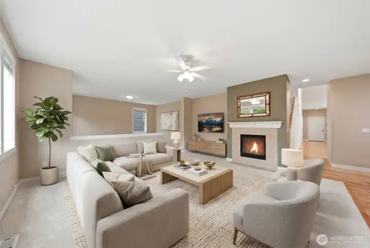 Virtually staged family room with a gas fireplace and brand new carpet.