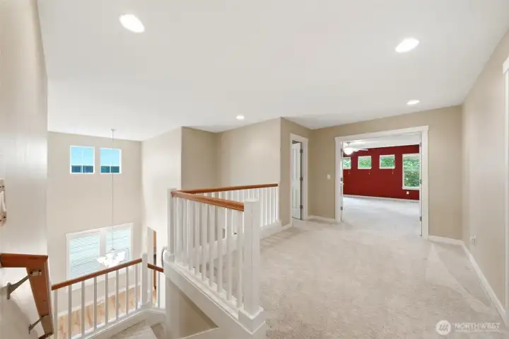 The open landing upstairs looks down over the living room.