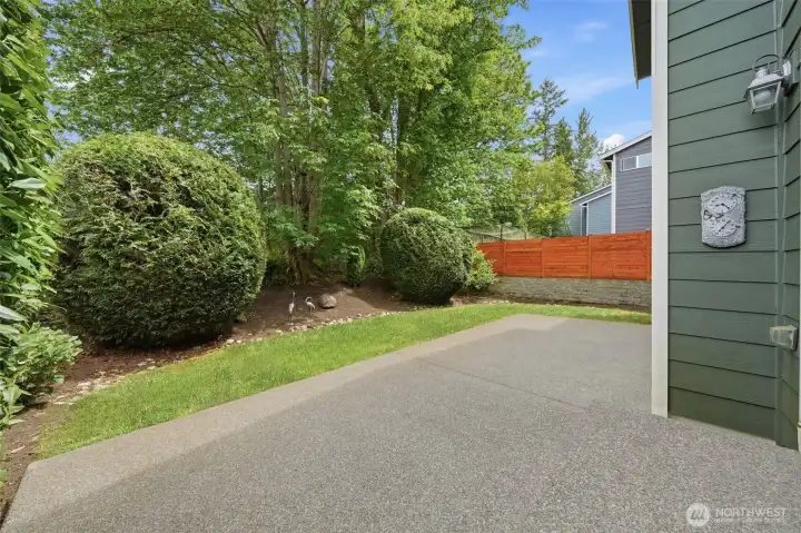 The back patio offers space to BBQ and retreat from afternoon sun.