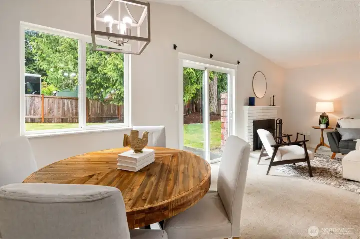 A dining space right off the living room benefits from terrific natural light.