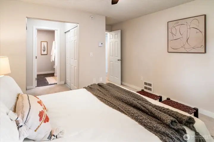Enjoy rest and restoration in the roomy and well-equipped primary suite: find dual closets, a ceiling fan, and a five-piece bathroom.